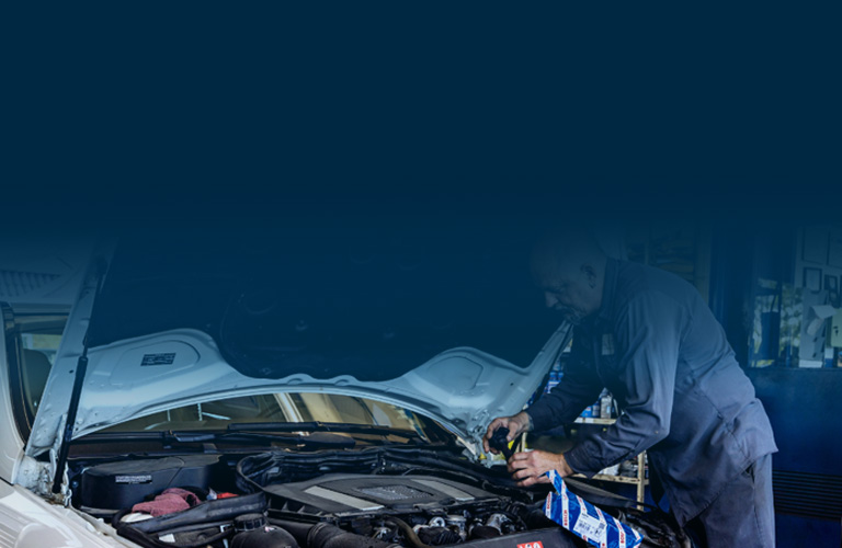 man working on car
